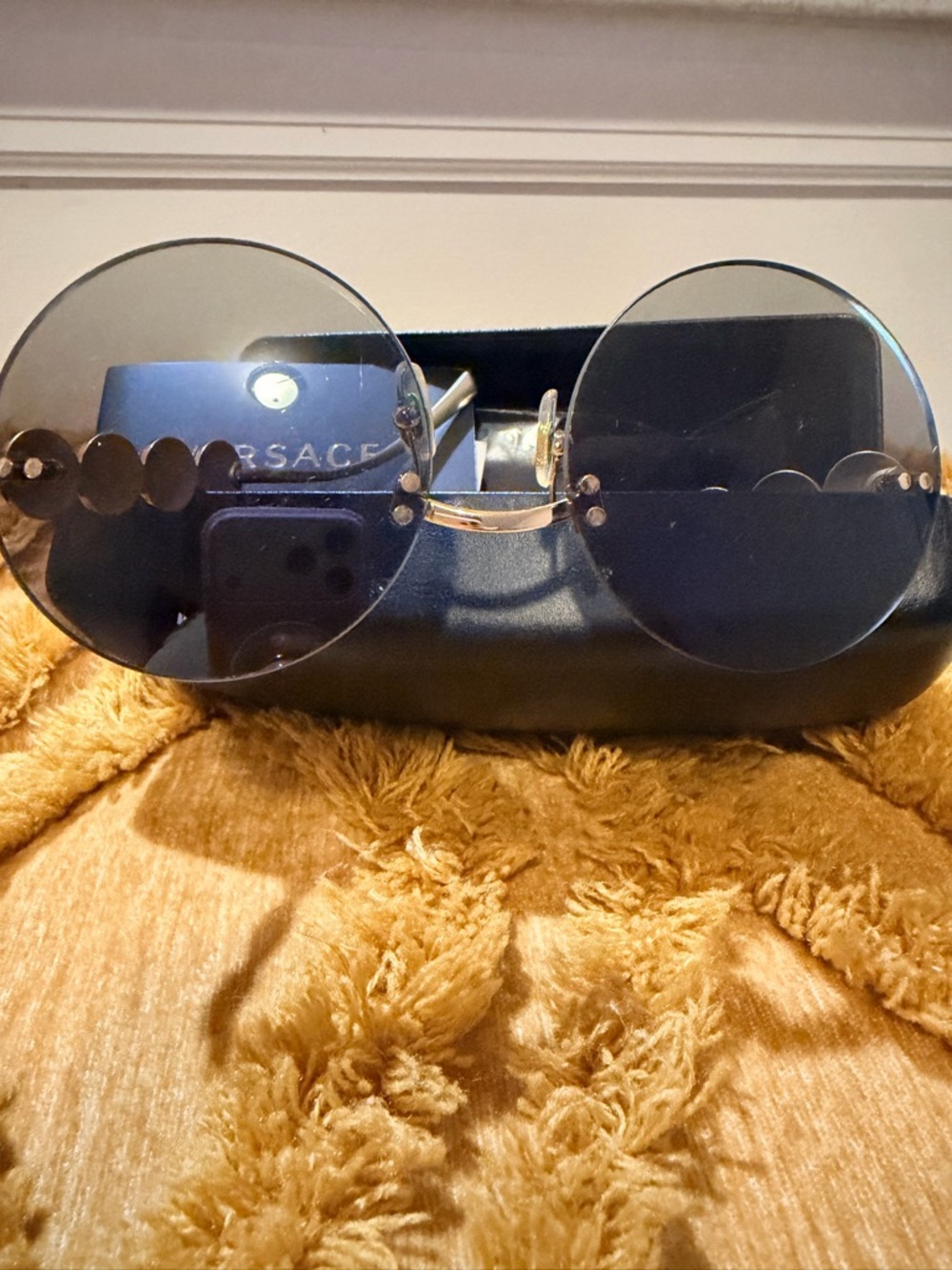 Versace Unisex Black and Gold Rimless Sunglasses with Signature Medusa Temples